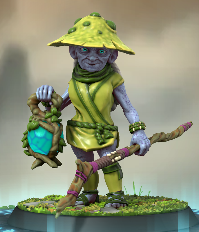 Une vielle Schtroumpfe habillée de vert, avec un chapeau champignon. Elle tient une lanterne magique et un bâton.